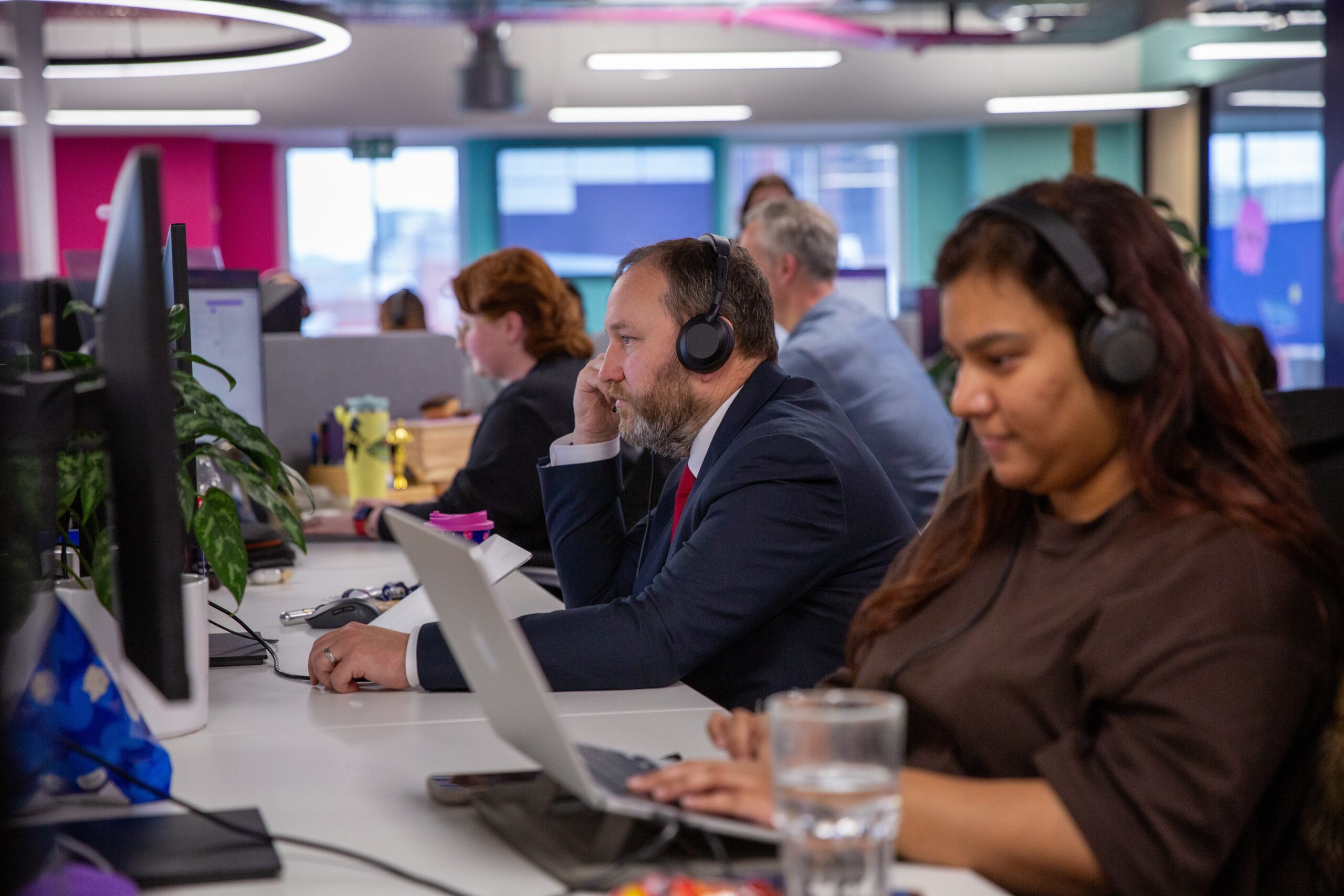 Ian Murray MP answers a customer call alongside other Octopus Energy call centre employees